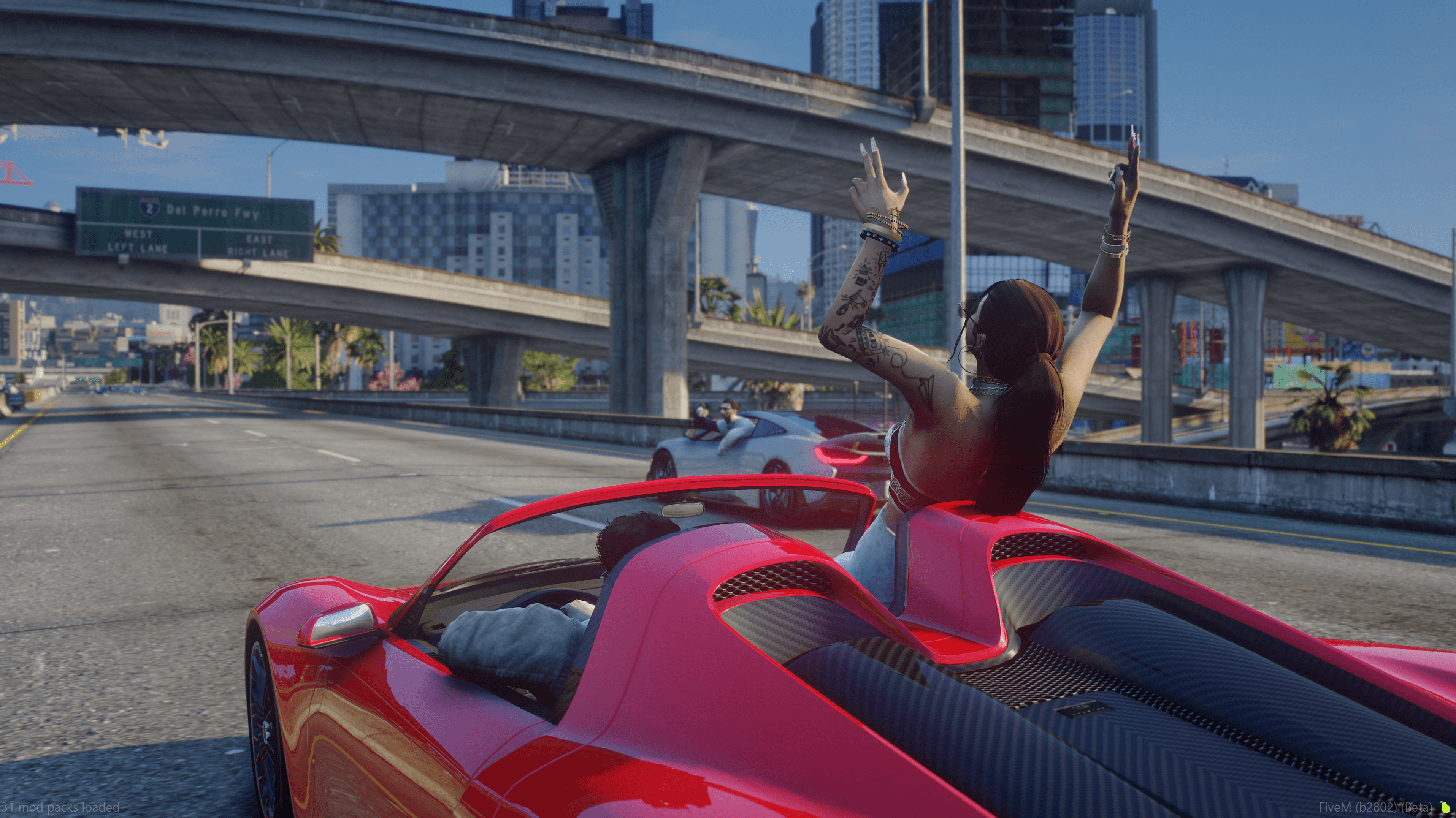 Player cruising the freeway in a red convertible